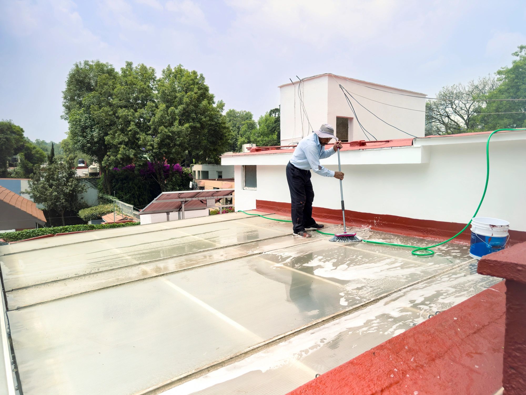 Exterior surface cleaning on a rooftop